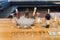 Empty glasses, bottle of assorted wine in a bowl with ice