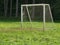 Empty goal in the meadow sunny day