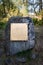 Empty golden plate on a rock in nature, mockup