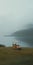 Empty Golf Cart On Foggy Fjord Cinematic Still Shot In Parajanov Style