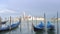 Empty gondola in Venice on waves