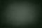 Empty gradient green blackboard background