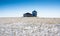 An empty grain silo on a harvested snow covered field on the Canadian prairies in Rocky View County Alberta.