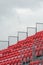 Empty grandstand with red seats