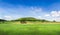 Empty grassland land with beautiful views, land plot for housing construction Green meadow and mountains