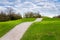 Empty Gravel Footpath up to a hill