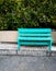 Empty green bench on the street