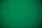 Empty green casino poker table cloth with spotlight