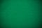 Empty green casino poker table cloth with spotlight