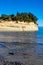 Empty green glass bottle thrown at Corfu beach