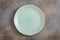 Empty green irregular plate above