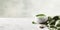 Empty green soup bowl with tablecloth and spoon on white marble table 3