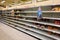 Empty grocery store shelves of bread before a hurricane or snow storm