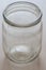 Empty half-liter glass jar on the table closeup