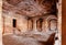 Empty hall of the 6th century Hindu temple of Badami, India. Caves for prayers in historical Indian structure