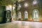 Empty hall in Sharovsky Castle with chandelier and fireplace