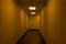 Empty hallway - dimly lit - orange glow - fluorescent light