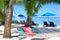 Empty hammock between palm trees on tropical beach