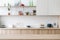 Empty hardwood countertop against blur kitchen interior