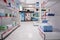 Empty health care facility shelves filled with vitamins and medicaments boxes