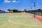 Empty high school netball court against the clear sky