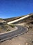 Empty highway curve , desert landscape