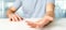 Empty holding hands of a young relaxed man over a desk