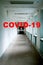 Empty hospital corridor, menacing atmosphere and drama. Concept - mortal danger from the pandemic covid