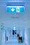 Empty hospital hallway. Exit sign. Medical healthcare concept