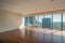Empty interior apartment with panoramic city view.