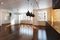 Empty interior residence with hardwood floors .