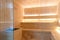 Empty interior of traditional Finnish sauna room. Modern wooden spa therapy cabin with hot dry steam