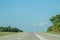 Empty interstate highway under a blue sky