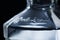 Empty Jack Daniels bottle close up macro shot isolated on black background.