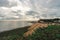 Empty Kingsgate Beach and Castle on the cliffs above the Bay, on cloudy autumn morning