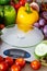 Empty kitchen scale. There are plenty of vegetables and fruits around. Concept of a healthy diet and counting calories