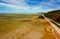 Empty Lake George nestled between farmland and Federal Highway in Australia