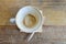 Empty latte coffee cup mug on wood table