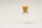 Empty little bottle with cork stopper isolated on white. transparent container. test tube. copy space