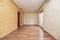 Empty living room with chestnut wood floors and freshly painted