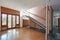 Empty living room with staircase, apartment interior in old house