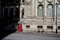 Empty london street scene with red telephone box and longs shadows in winter sun in front of old 19th century building