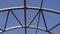 Empty long glass tunnel on the pedestrian bridge,The camera moves through glass tunnel on sunny day with blue sky, at