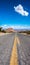 Empty long nevada mountain road to the horizon on a sunny summer day at bright sunset. vertical image for your reel and story