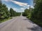 An empty long rural slope mountain road