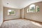 Empty master bedroom with window and high vaulted ceiling