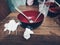 Empty melamine red black bowl with spoon fork tissue tooth picks above wooden table showing after finish meal in small restaurant