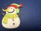 Empty message area with snowman figure as note paper on dark and light navy blue background.