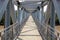 A empty metal foot bridge, perspective view.