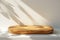 Empty Minimal Natural Wooden Table Counter Podium with Beautiful Wood Grain in Sunlight and Shadow on White Wall for Luxury